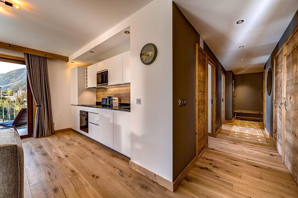 Hall opens into bright living area