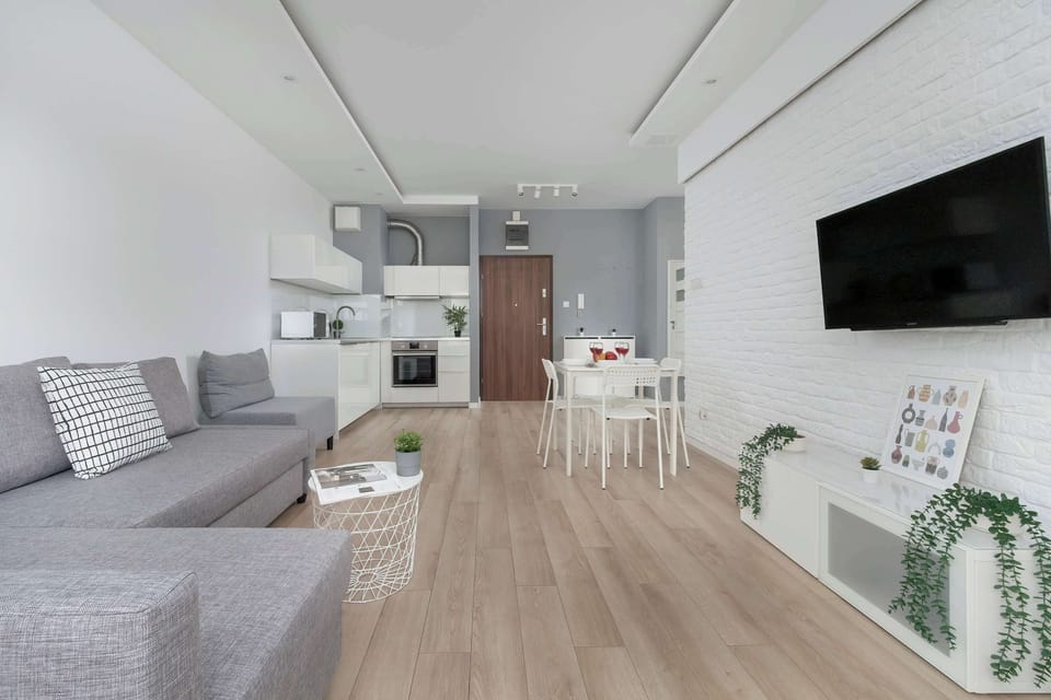 The open-plan living and kitchen area creates a modern, cohesive space ideal for cooking and relaxing together.