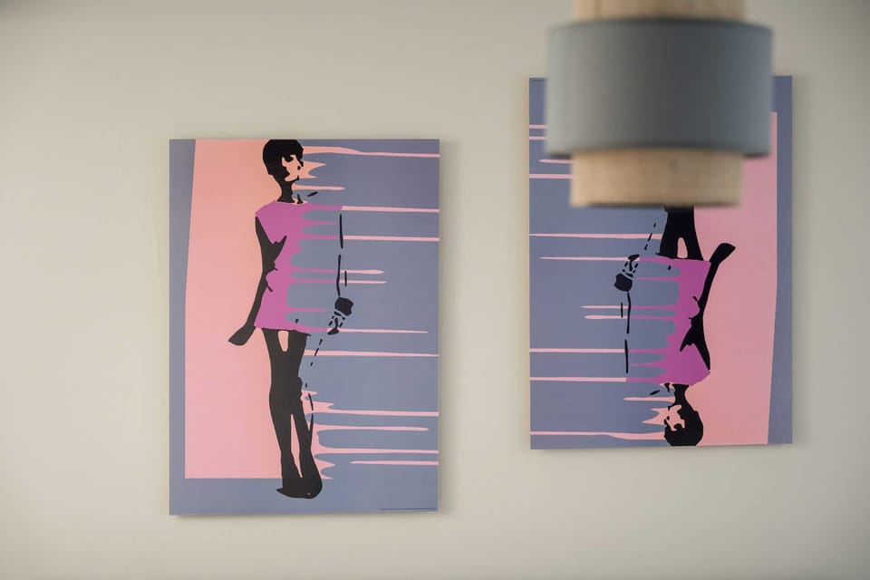 Modern artwork in vivid colors adds character and energy to the interior.