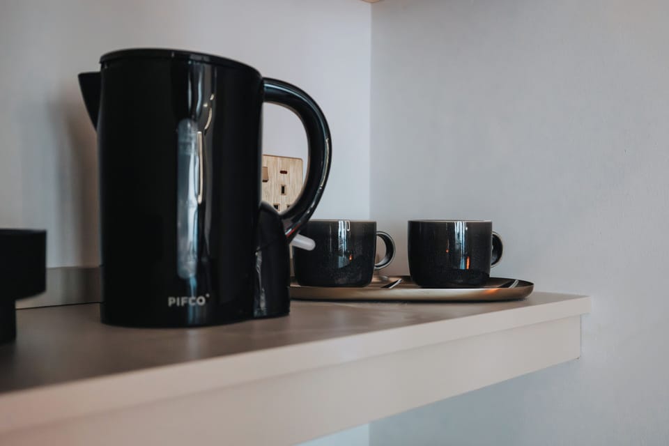 A handy tea, coffee, and sugar station is ready for you to enjoy a warm drink whenever you like.
