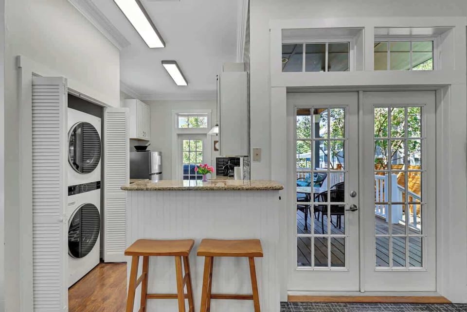 Kitchen: Bright and airy space with granite countertops and a view to the inviting deck!