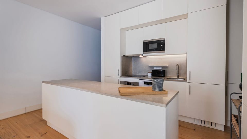 Sleek, minimalist kitchenette with modern appliances and clean lines.
#Portugal #PT #Lisbon #UrbanLiving #ModernStyle