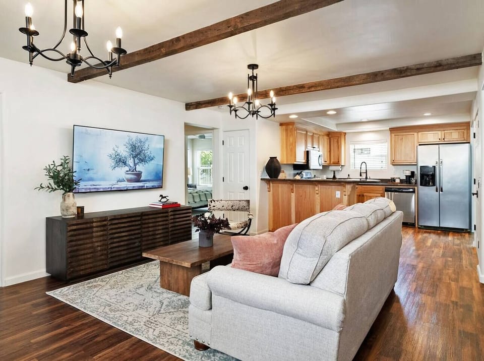75" TV and a sofa couch
