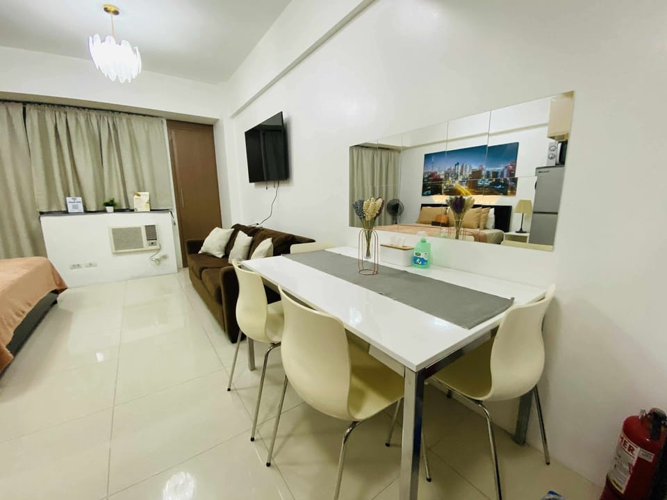 Studio, Balcony, City View | Living area | Flat-screen TV
