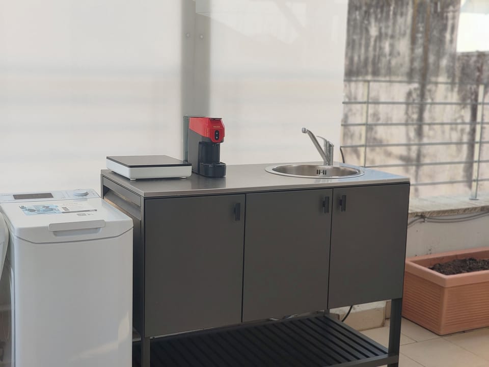 Deluxe Duplex, City View | Private kitchen | Mini-fridge, stovetop, cookware/dishes/utensils