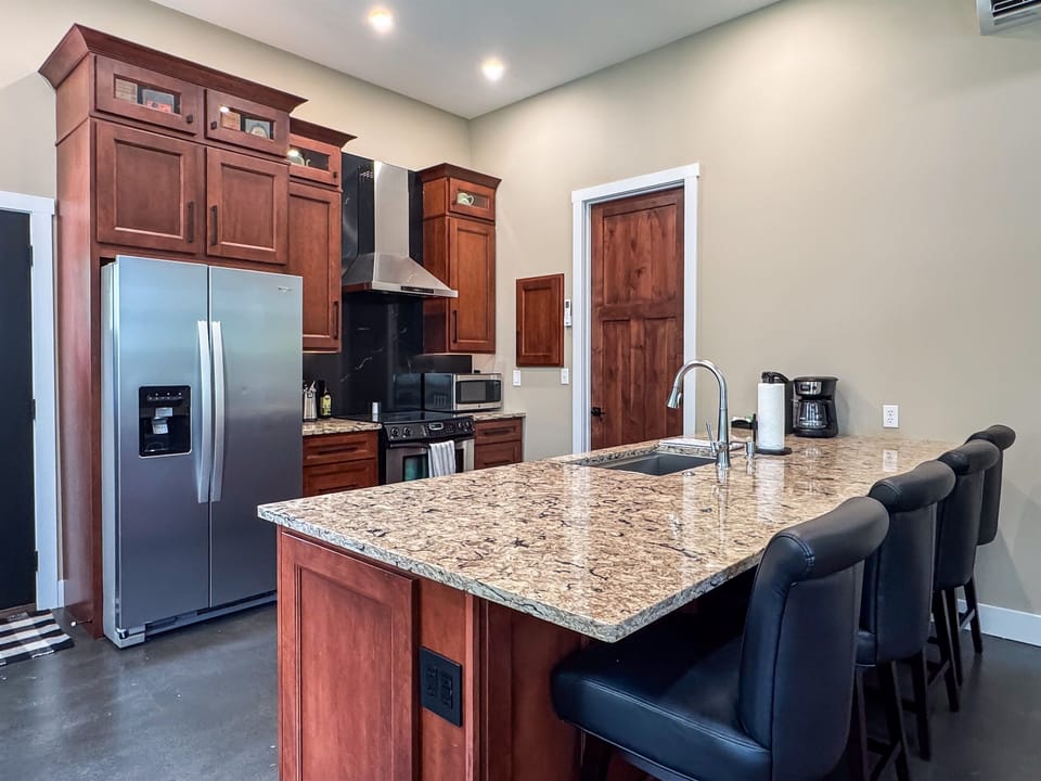 Full kitchen with ample counter space, kitchen tools and small appliances.