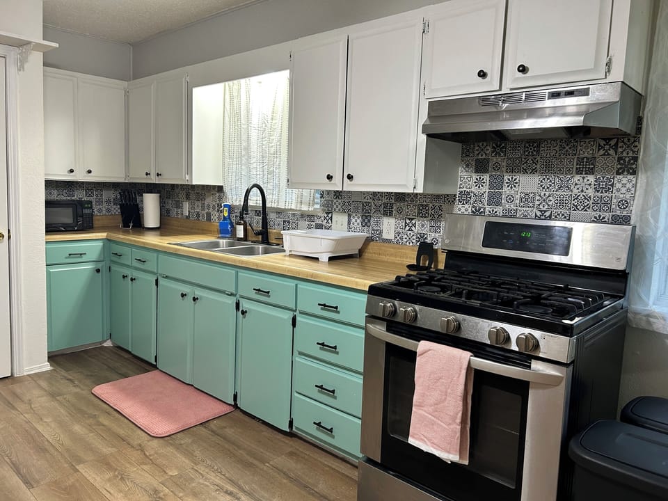 The open kitchen is fully stocked to prepare meals like you would at home.