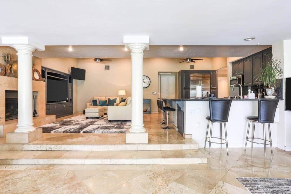 Main living room opens up to the next room.