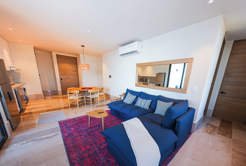 Comfort Apartment, Ocean View | Living area | 50-inch flat-screen TV with digital channels