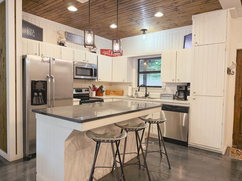 Fully stocked, bar seating, and rustic charm.