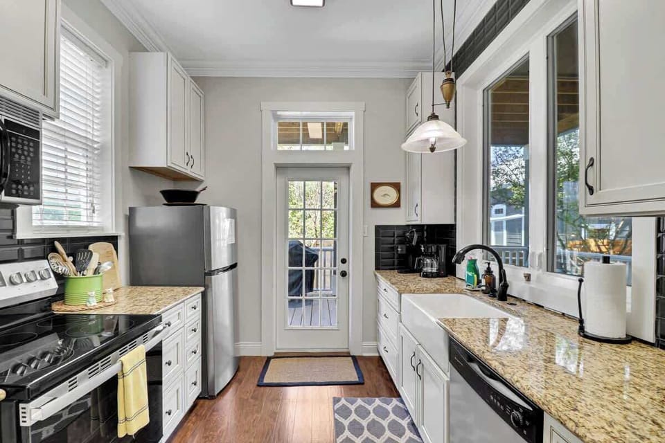 Main House Full Kitchen: Stylish space with modern appliances and sunlit views!