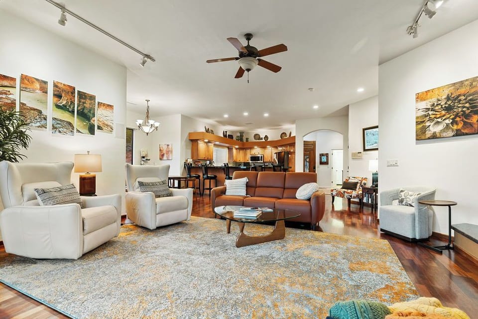 Open concept floor plan with reclining swivel rockers and reclining sofa seating