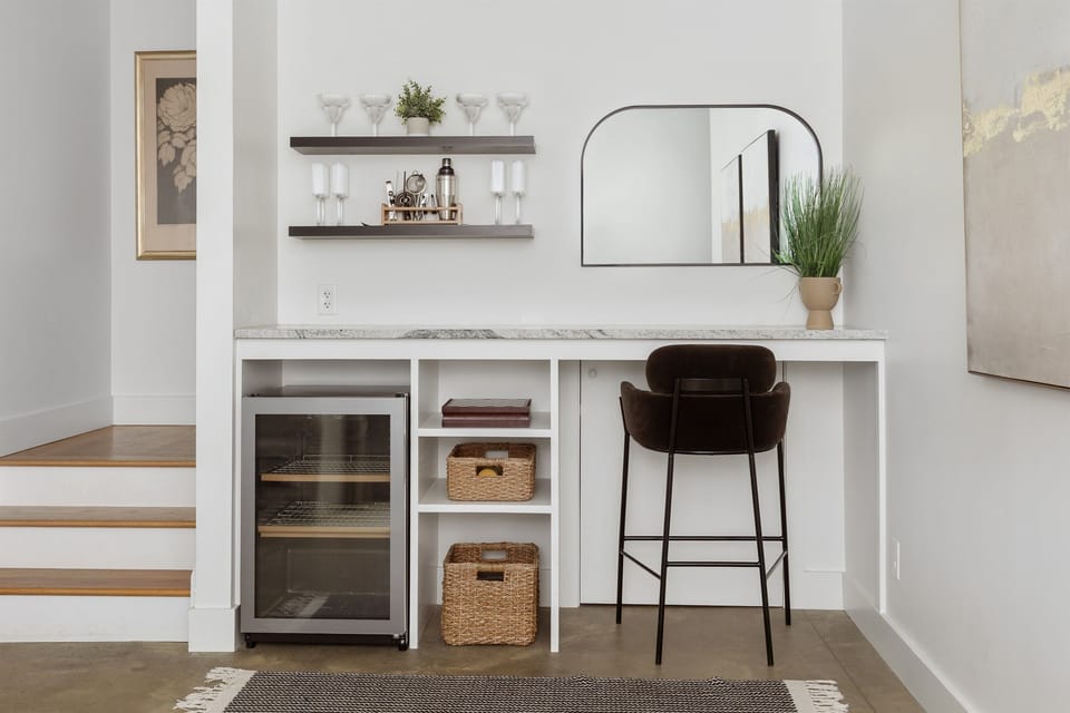 {Bar Nook} Fully stocked with glassware, a wine fridge, and bar essentials—your private Asheville happy-hour headquarters.