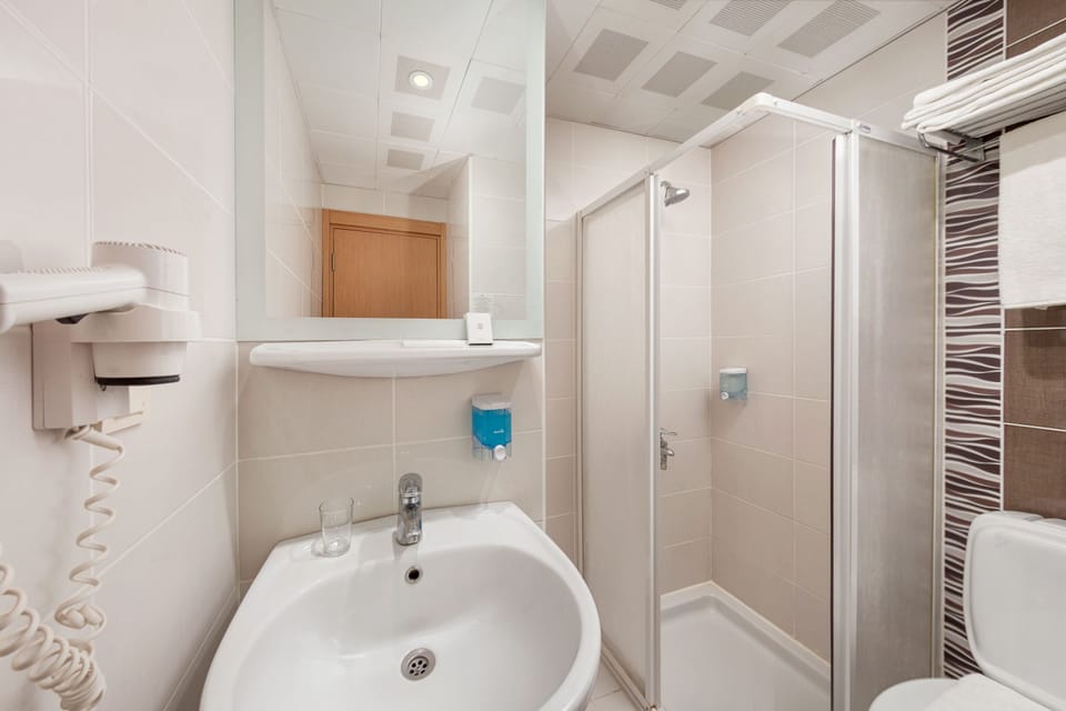 Shower, free toiletries, hair dryer, slippers