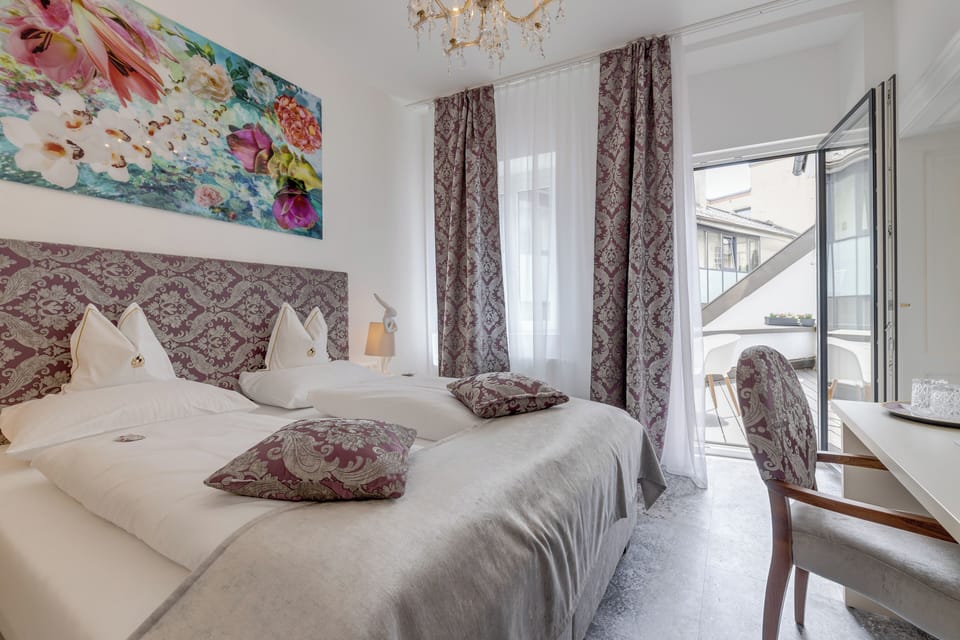 Luxury Double Room, Balcony, Courtyard View | Desk, laptop workspace, blackout drapes, soundproofing