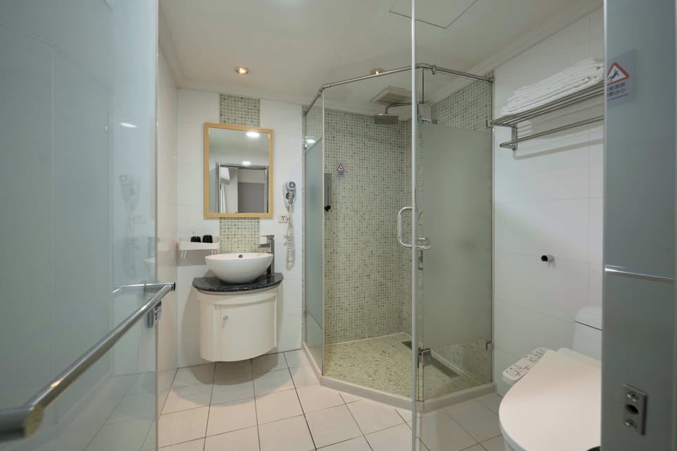 Hair dryer, slippers, towels, shampoo