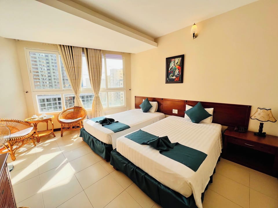 Superior Double or Twin Room, Partial Sea View | Minibar, in-room safe, desk, laptop workspace