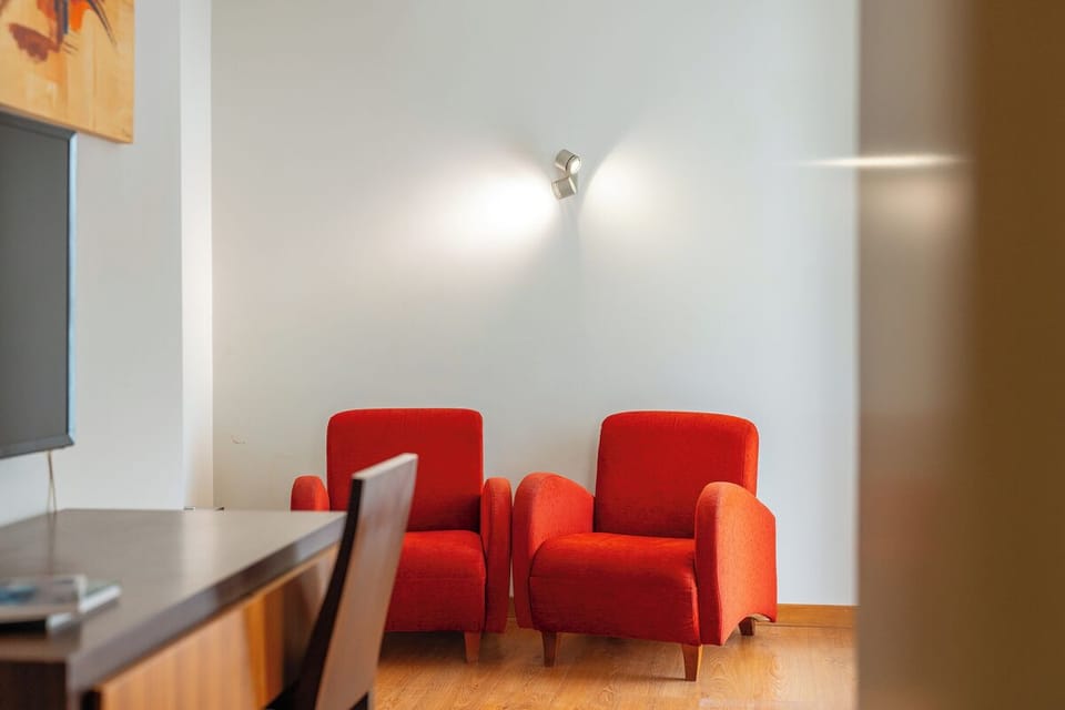 Relax with a drink in two comfortable, inviting armchairs.