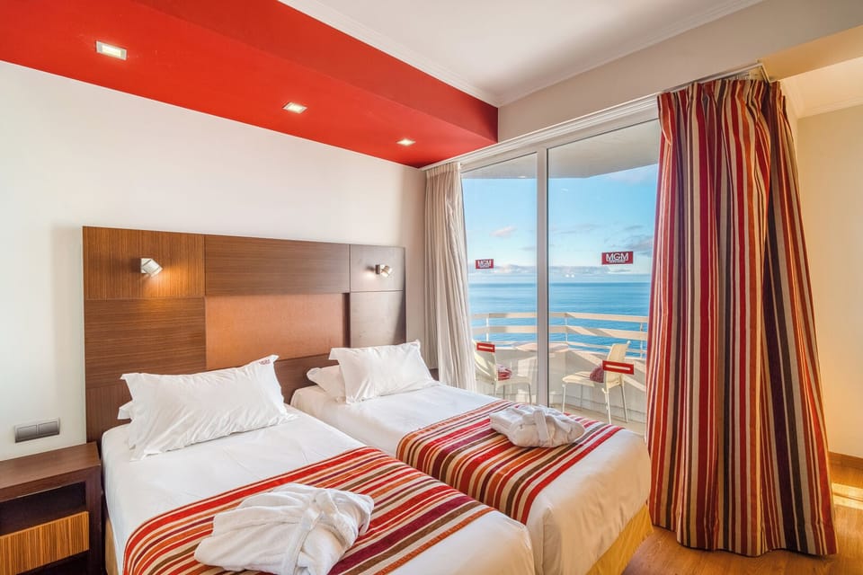 Step into sunshine and savor the sea from bed.