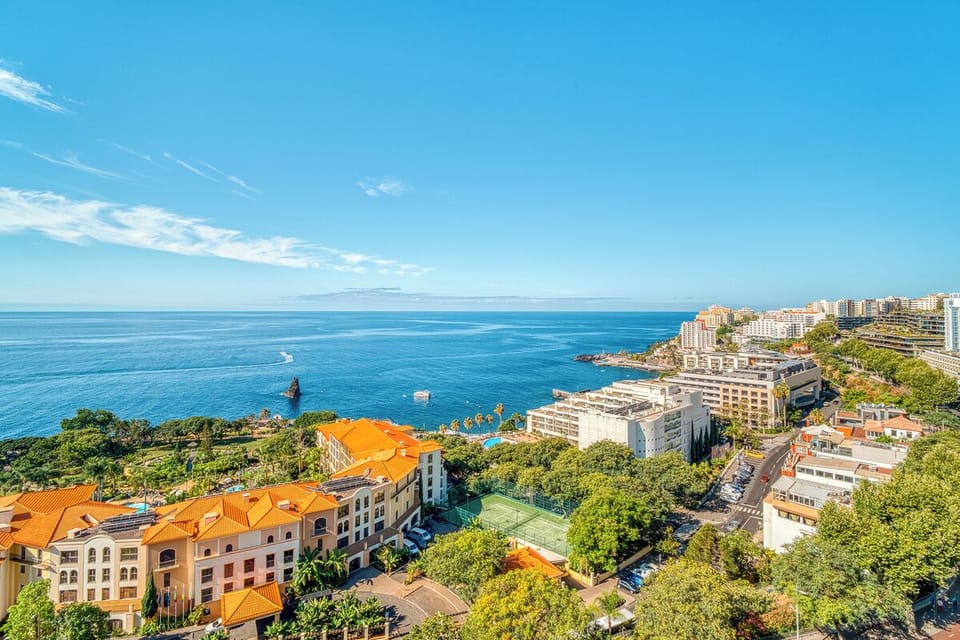 Soak in panoramic ocean views over colorful coastal rooftops.