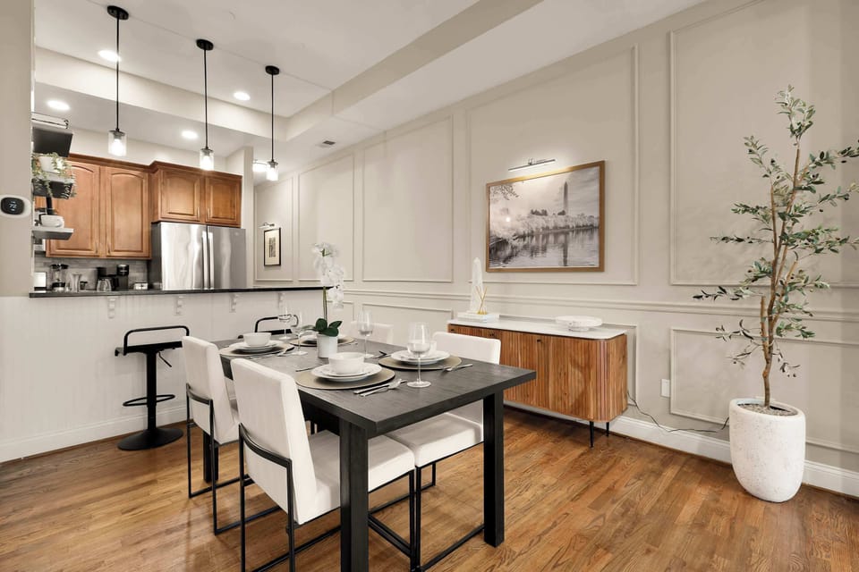 The open layout creates a natural flow between the dining area and the fully-equipped kitchen. Whether you’re hosting a dinner or enjoying takeout from one of DC’s top restaurants, this space makes it easy to connect.