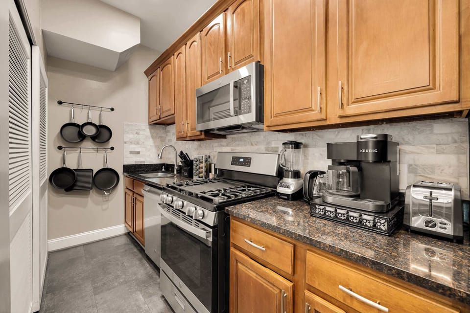 Well-stocked cabinets hold everything you’ll need for meals—from cookware and utensils to wine glasses and dinnerware. Perfect for those who love to cook and entertain.