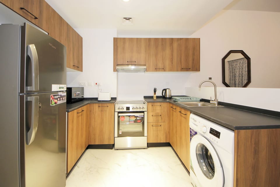 Apartment, Pool View | Private kitchen | Full-size fridge, microwave, oven, stovetop