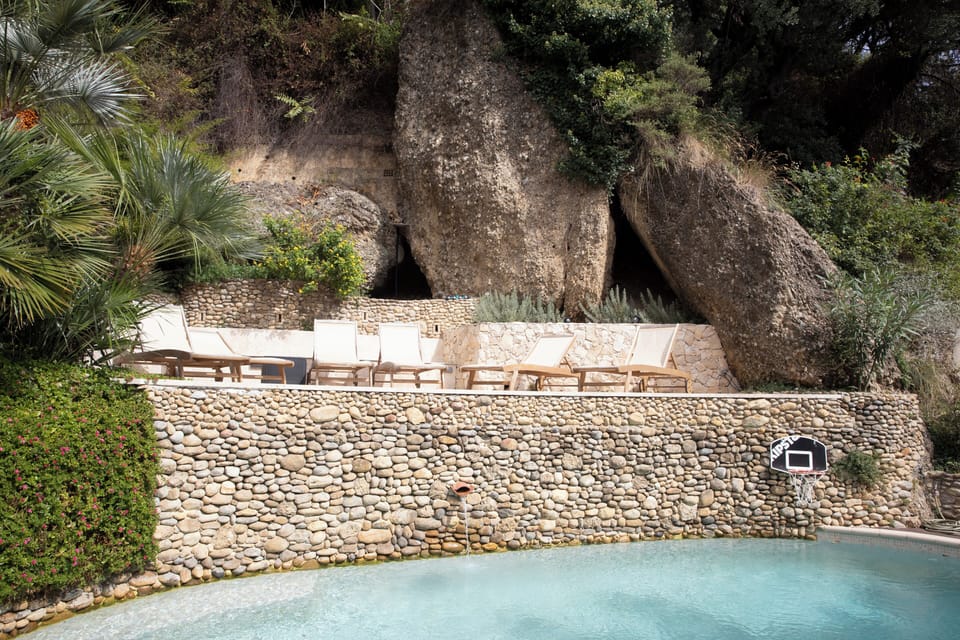 Pool embedded in a natural landscape with gigantic rocks and nature.Very private