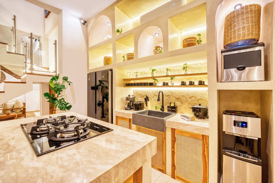 Gather, cook, and connect in a space where natural textures meet modern ease in the fully equiped kitchen