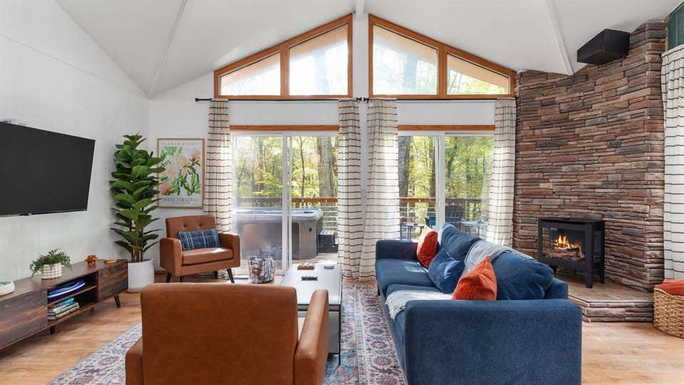 Relax in the cozy, sunlight filled family room, with a view of the woods.