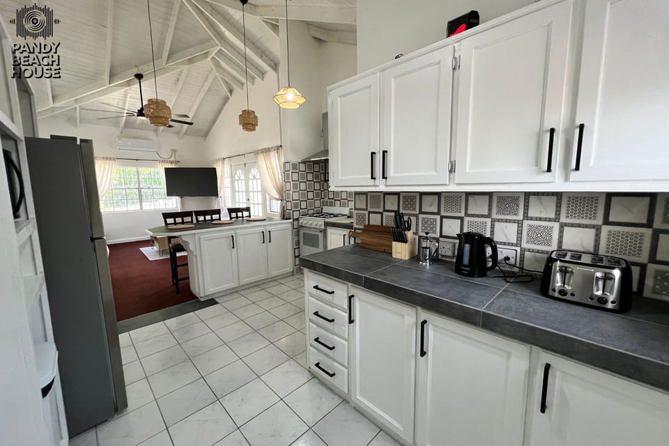 Open-plan kitchen with plenty of appliances for easy home cooking.