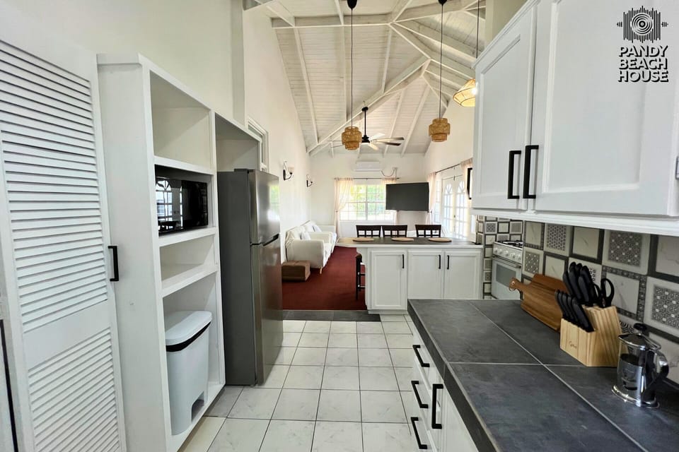 Open-plan kitchen with plenty of appliances for easy home cooking.