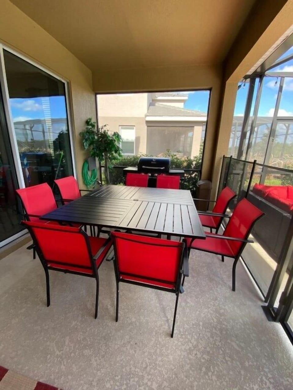 Sit at the table enjoying a snack while watching a heated ping pong match while the kids are swimming in the pool 