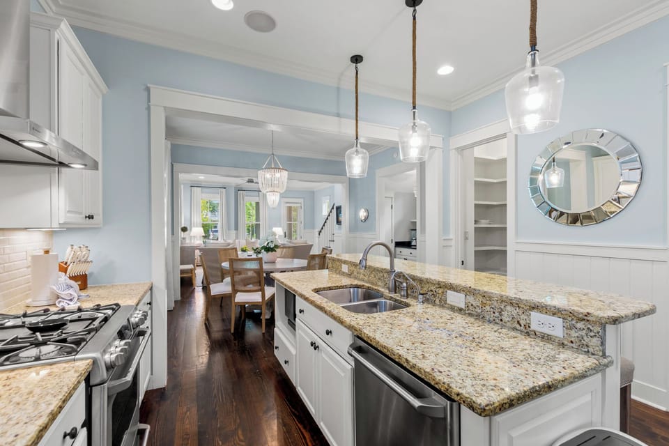 Chef-friendly kitchen w/ gas range, generous counter space & sightlines into the dining room.