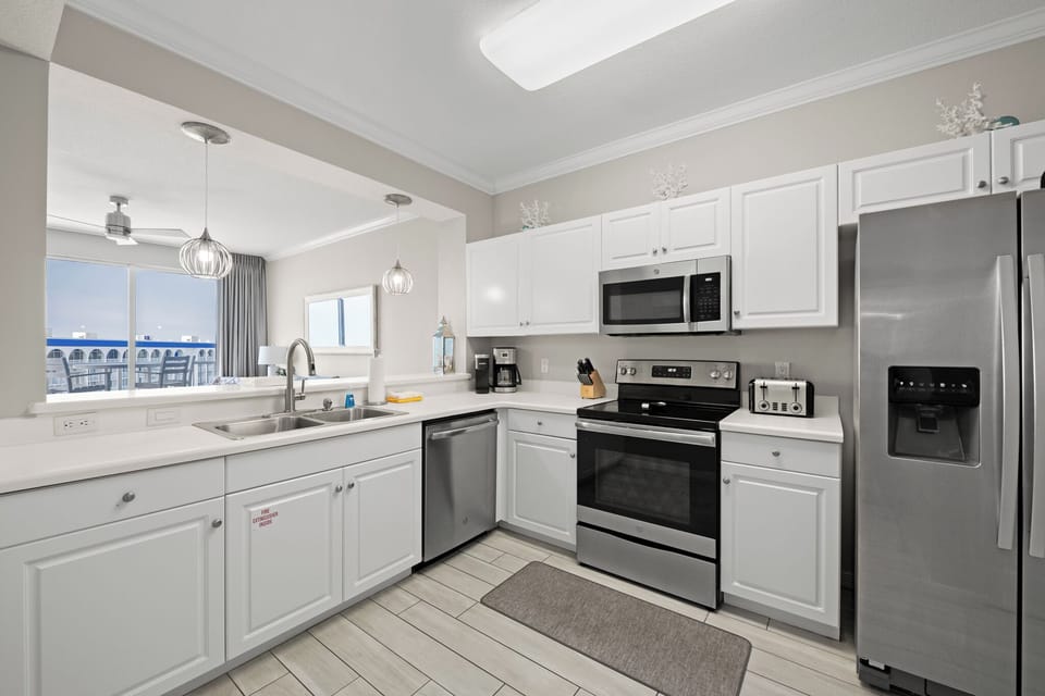 Bright kitchen w/ clean lines and plenty of counter space for easy meals.