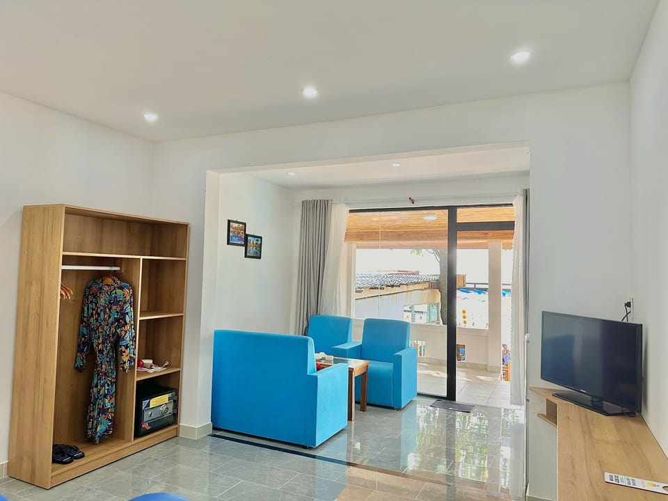 Luxury Bungalow, Beachfront | Minibar, in-room safe, desk, blackout drapes