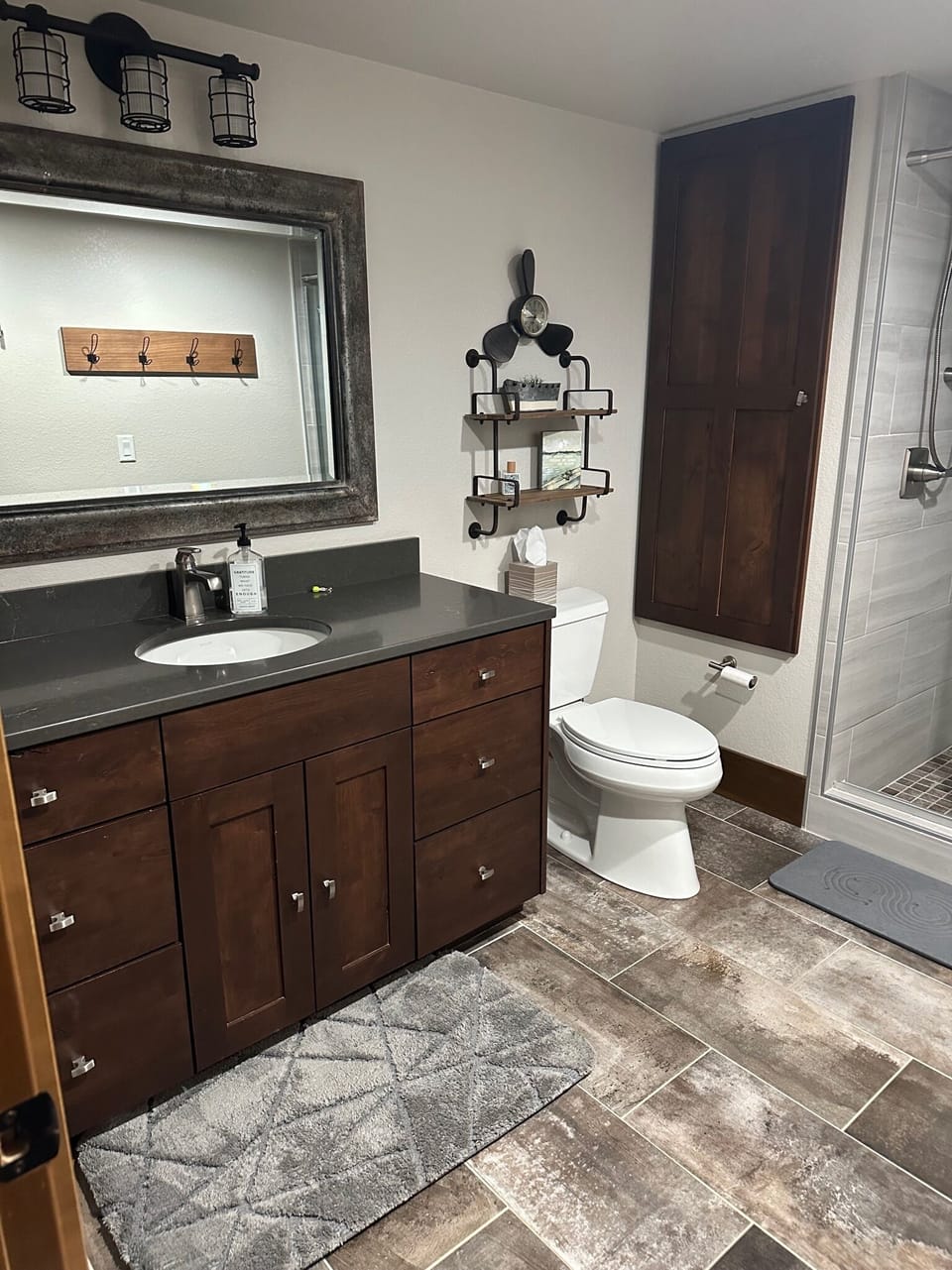 2nd Level Bathroom features tile floor, custom cabinets and countertop