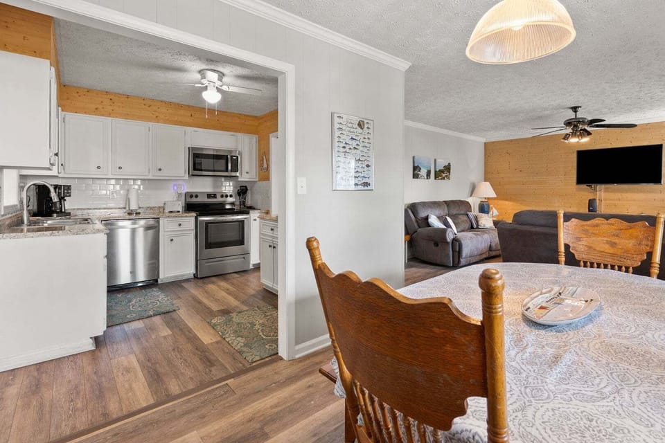 Open-concept kitchen, dining and living space at Wells Tales, a 4-bedroom Cherry Grove vacation rental