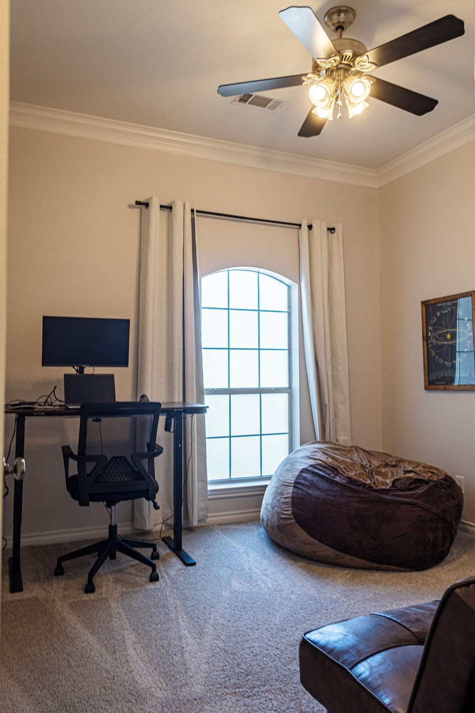 Office with fold out futon and bean bag.