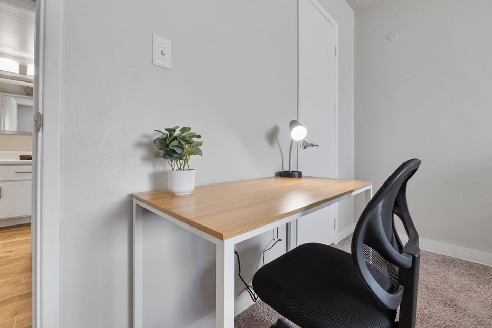 💻 Dedicated desk and chair for remote work.