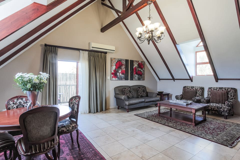 Penthouse | Living area | Flat-screen TV