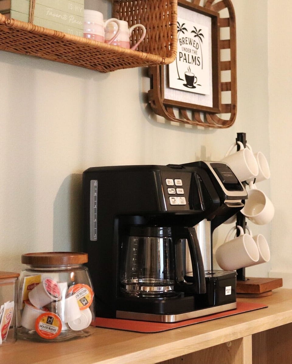 Stocked coffee and tea bar along with electric kettle