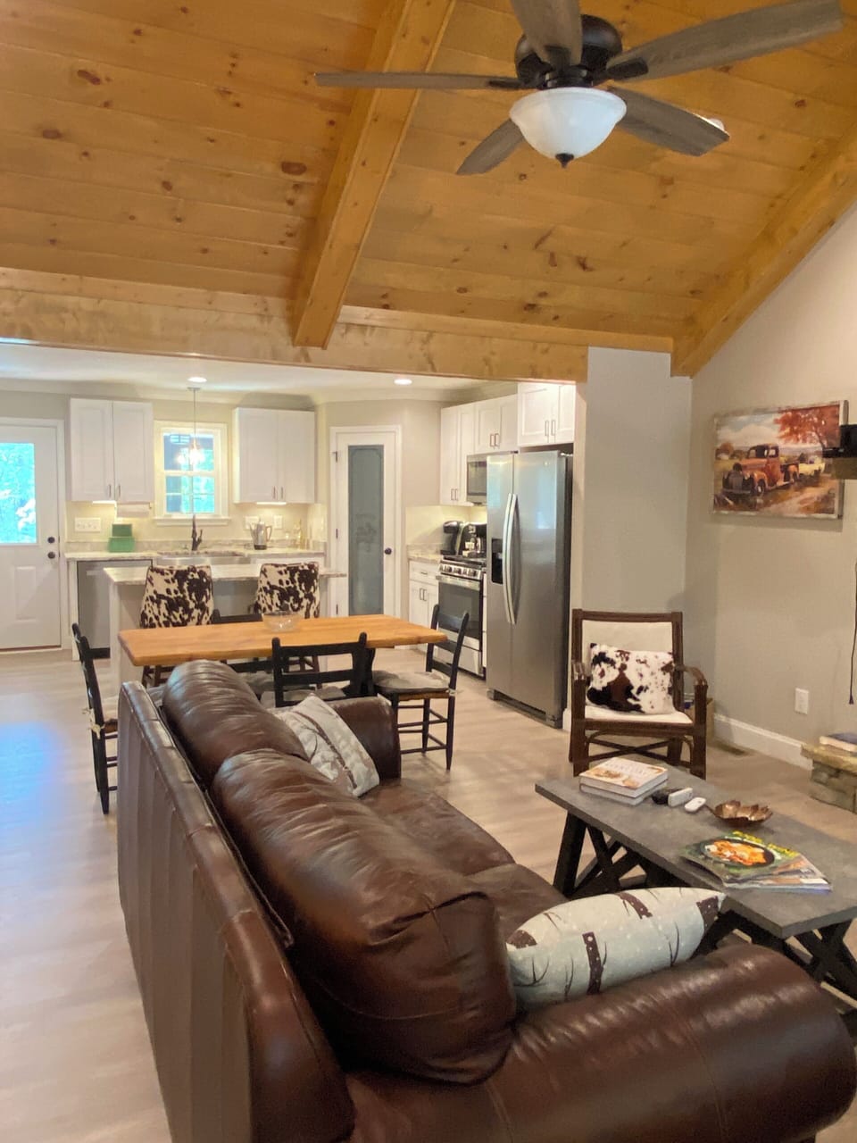 Relax on plush leather furniture while enjoying the open floor plan