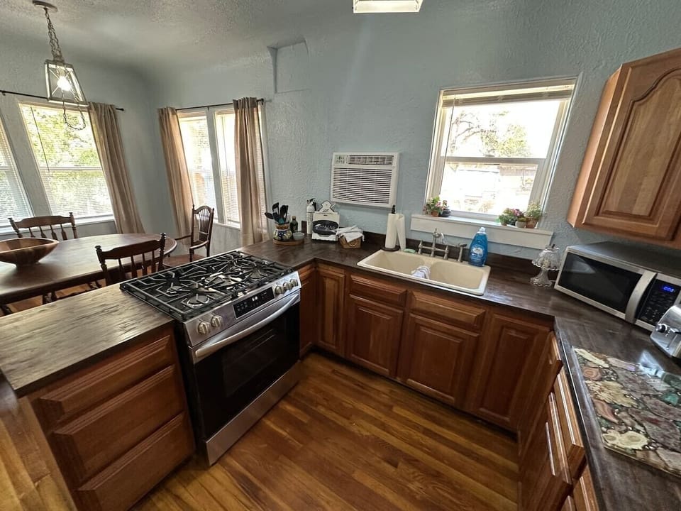 The kitchen in the cabin features a gas stove/oven, microwave, toaster, fridge with water/ice dispensers, coffee maker, and dishwasher.
