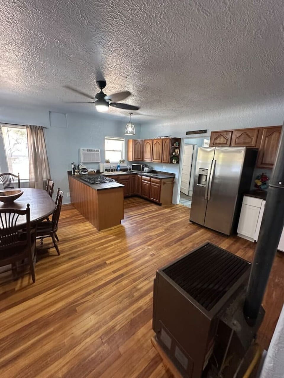 Open concept floor plan view of kitchen and dining areas.