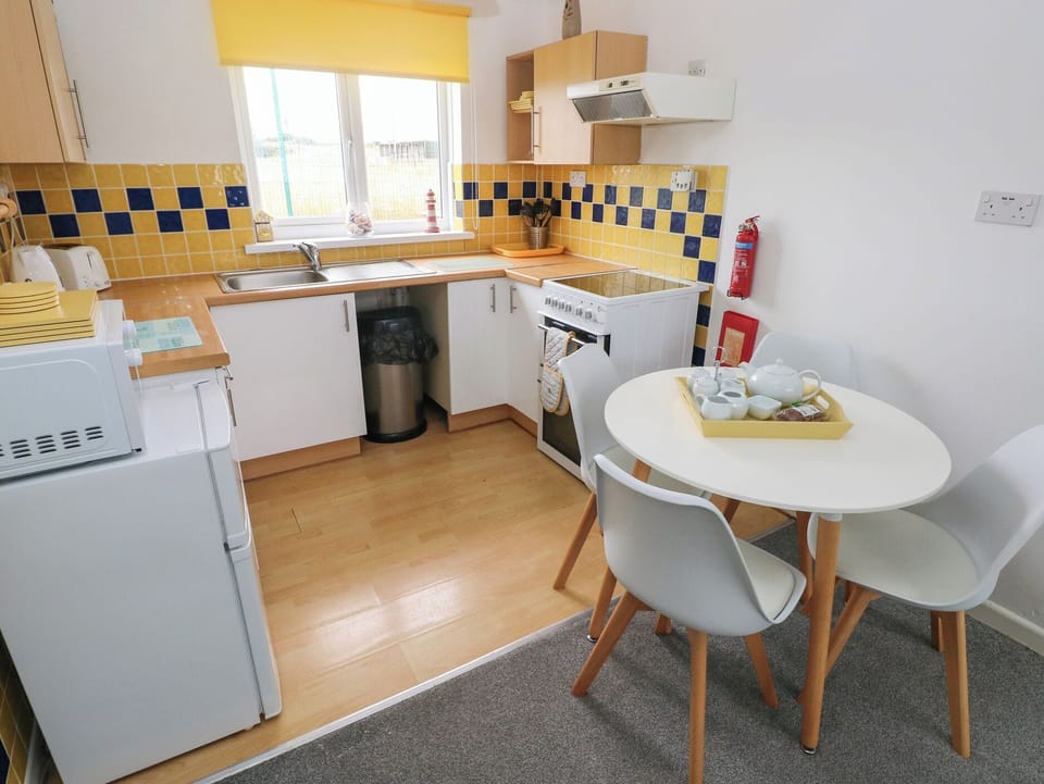 Fridge, microwave, toaster, cookware/dishes/utensils