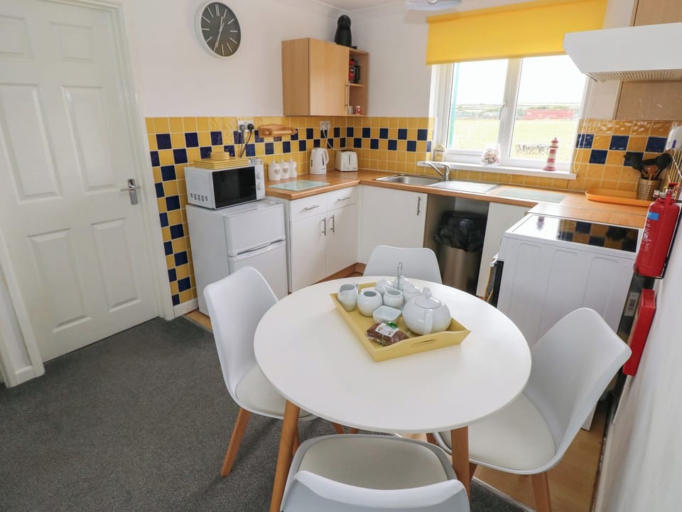 Fridge, microwave, toaster, cookware/dishes/utensils