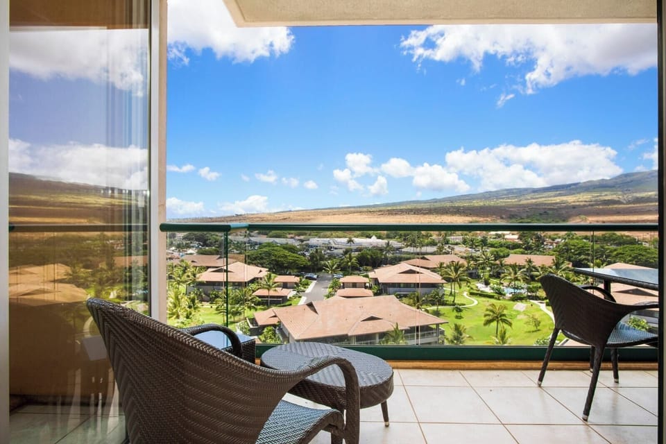 Relaxing balcony chairs with tropical garden and mountain ridge views. HKK-920