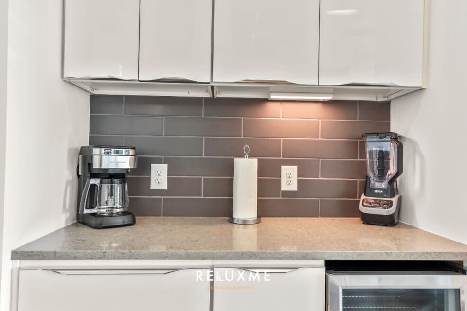 Stainless steel appliances, ample counter space, and a coffee machine for your convenience.