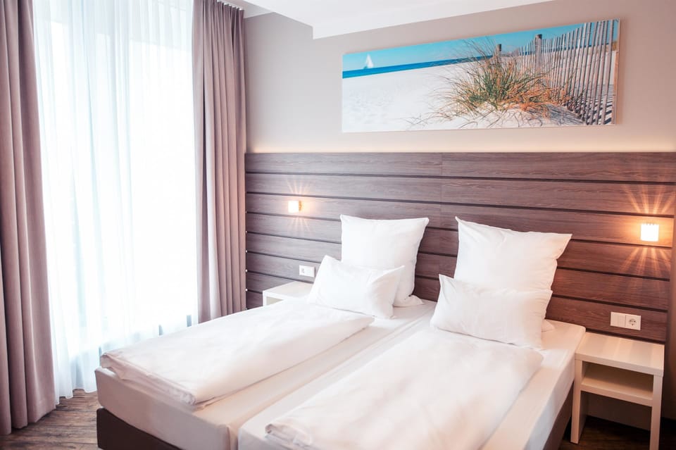 Hypo-allergenic bedding, desk, blackout drapes, soundproofing
